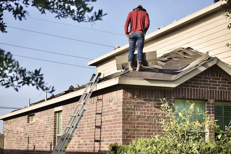 Professional roofer working on a residential roof in Trophy Club